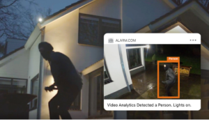 Image of a porch pirate on a homeowner's property with an alarm.com notification on the right.