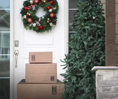 Packages placed in front of a house door.